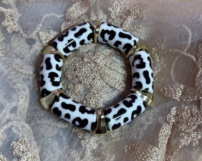 Bracelet élastiqué perles tubes acrylique Léopard blanc et noir Doré Chic +++